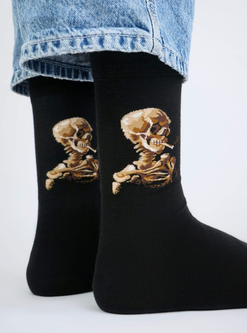 Skull of a Skeleton with Burning Cigarette