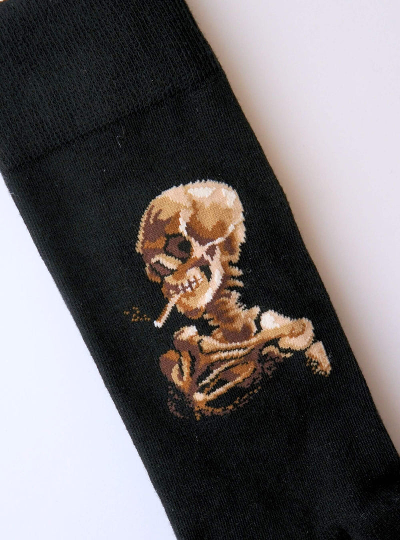 Skull of a Skeleton with Burning Cigarette